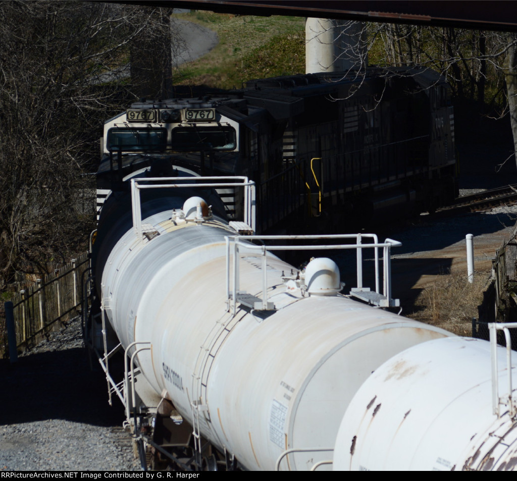 NS yard job E19 pauses while conductor lines switches to get into the interchage yard with CSX.